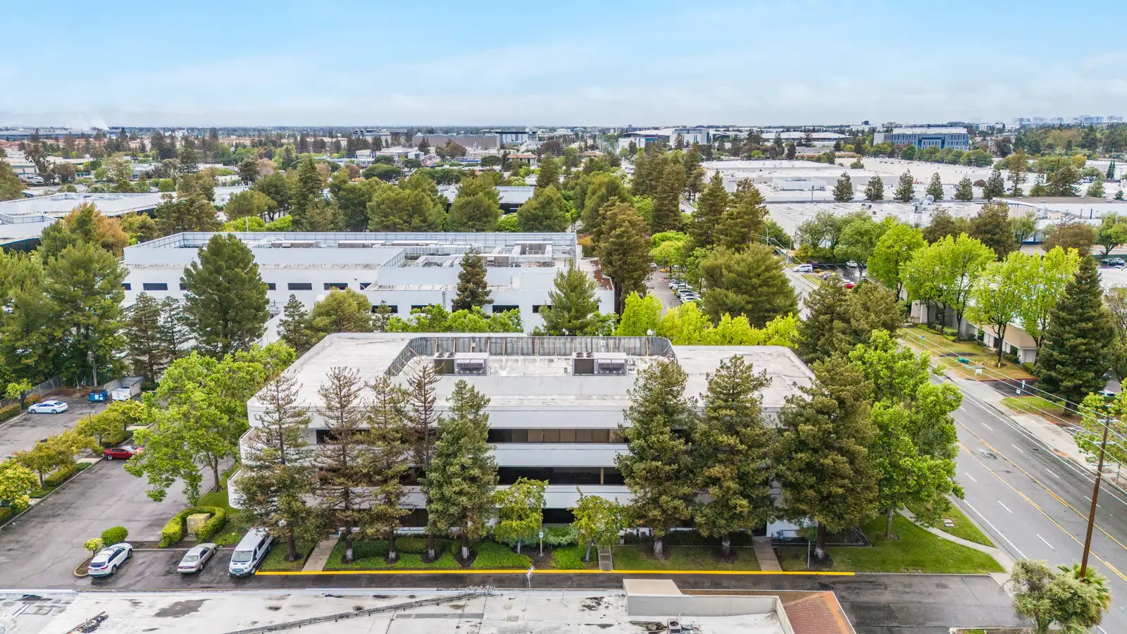 Aerial view of 3235 Kifer Rd in Santa Clara, a three-story office building David Giambruno is leasing